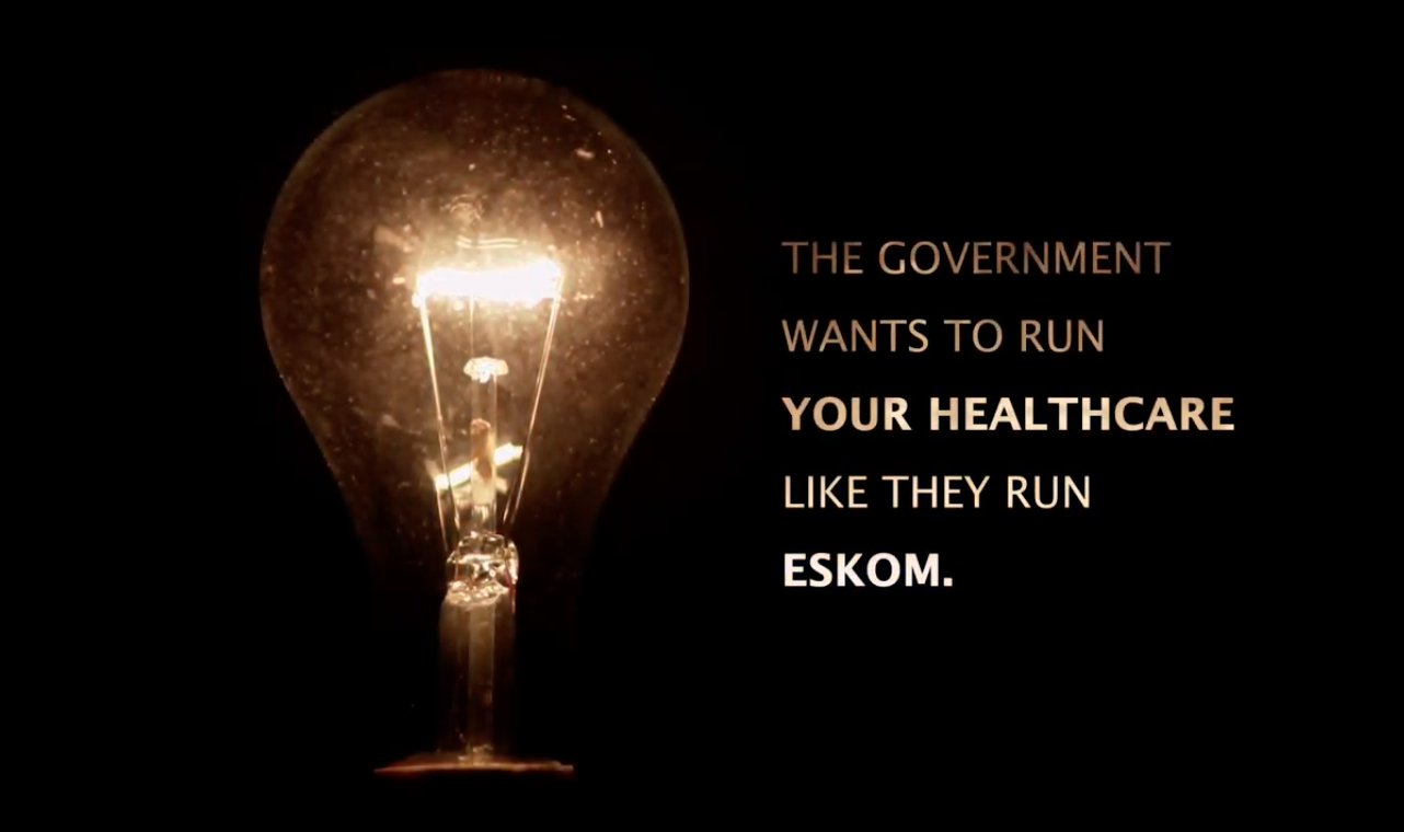 A black background with a lightbulb shining weakly next to the following text: “The government wants to run your healthcare like they run Eskom"